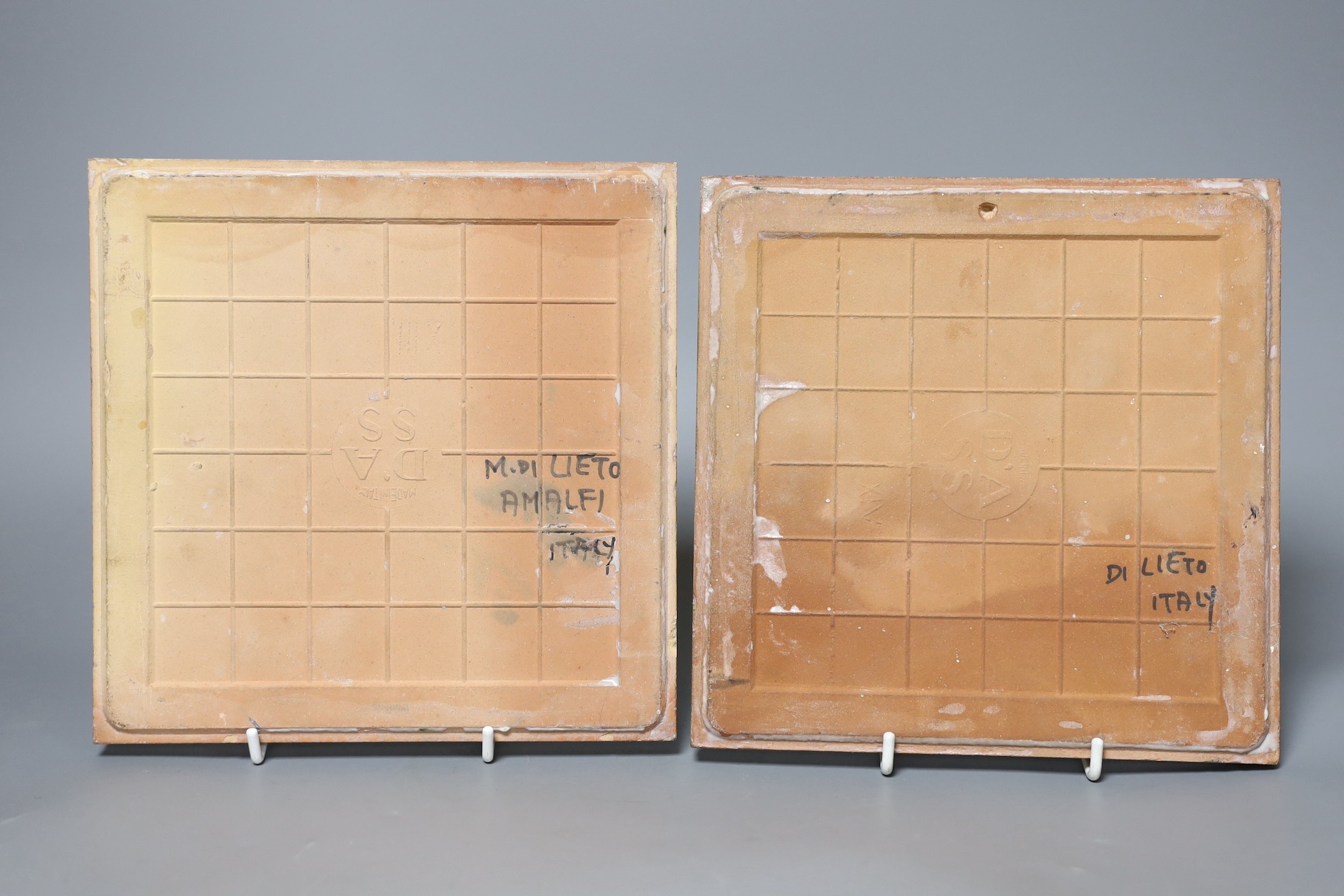 Two M. di Lieto, Italian Amalfi, 1950's figurative faience tiles, 20cm square